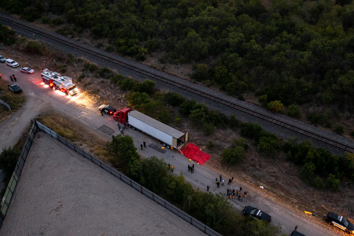 In this aerial view, members of law enforcement investigate a tractor trailer on Monday in San Antonio, Texas.