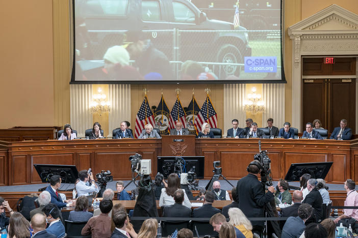 A video of then-President Donald Trump's motorcade leaving the Jan. 6 rally on the Ellipse is displayed as Cassidy Hutchinson, a former top aide to then-White House Chief of Staff Mark Meadows, testifies about Trump's actions on that day.