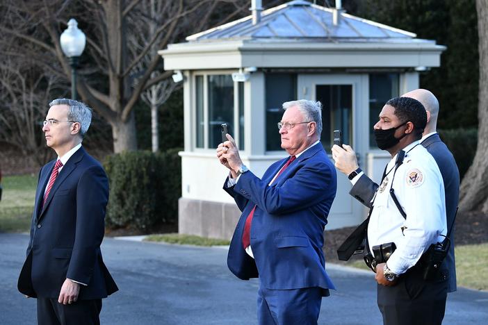White House Counsel Pat Cipollone, left, is seen with Keith Kellog, center, national security adviser to Vice President Mike Pence, watching Marine One carrying President Donald Trump leave the White House ahead of President-elect Joe Biden's inauguration on Jan. 20, 2021.