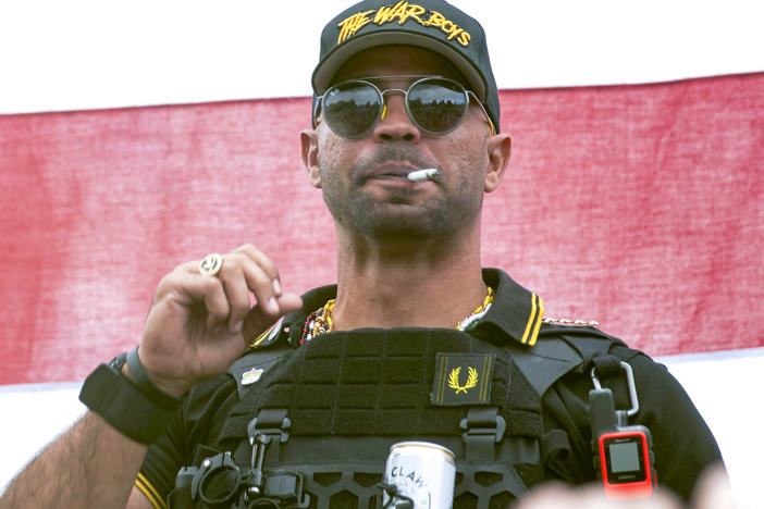 Proud Boys leader Henry "Enrique" Tarrio wears a hat that says The War Boys during a rally in Portland, Ore., Sept. 26, 2020. Tarrio, the former top leader of the Proud Boys, will remain jailed while awaiting trial on charges that he conspired with other members of the far-right extremist group to attack the U.S. Capitol.