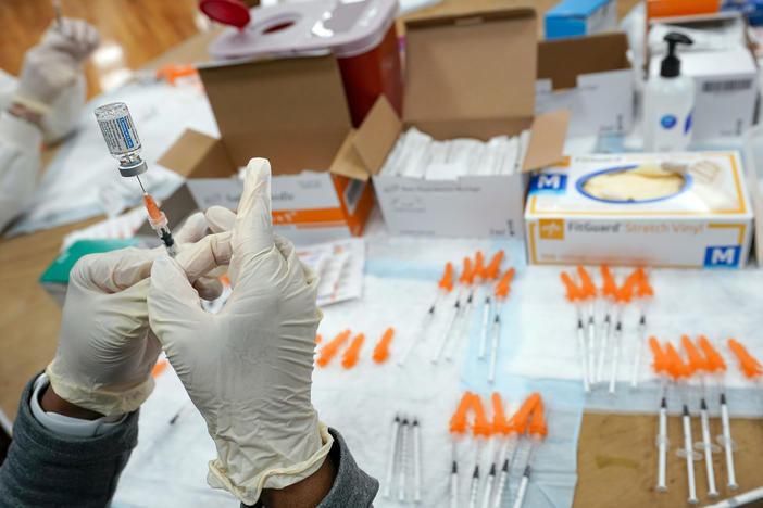 A nurse fills a syringe with a COVID-19 vaccine in the Staten Island borough of New York on April 8, 2021. The Food and Drug Administration on Thursday recommended that COVID booster shots be modified to better match more recent variants of the coronavirus.