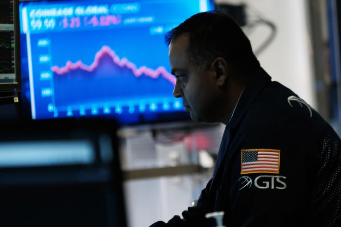 Traders work on the floor of the New York Stock Exchange.