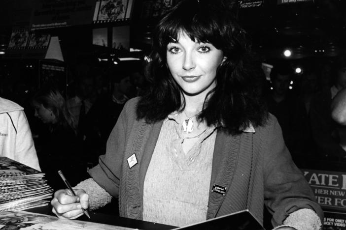 Kate Bush signing records in 1980.