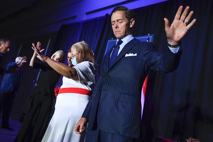 Ralph Reed prays on stage during a Donald Trump campaign event courting devout conservatives by combining praise, prayer and patriotism, Thursday, July 23, 2020, in Alpharetta, Ga.