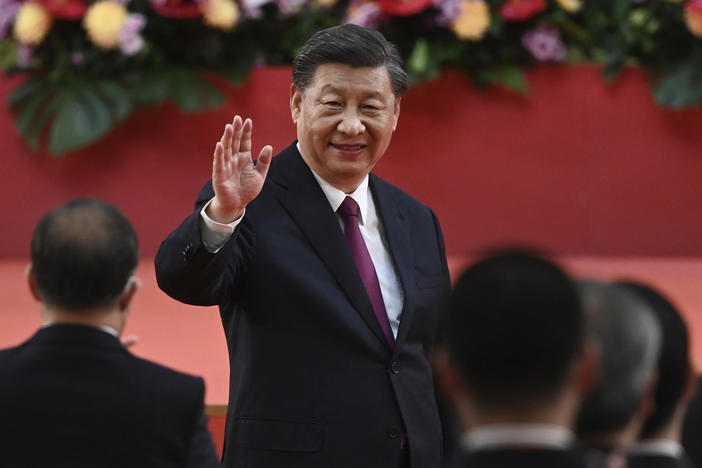 China's President Xi Jinping waves following his speech after a ceremony to inaugurate the city's new government in Hong Kong Friday, July 1, 2022, on the 25th anniversary of the city's handover from Britain to China.