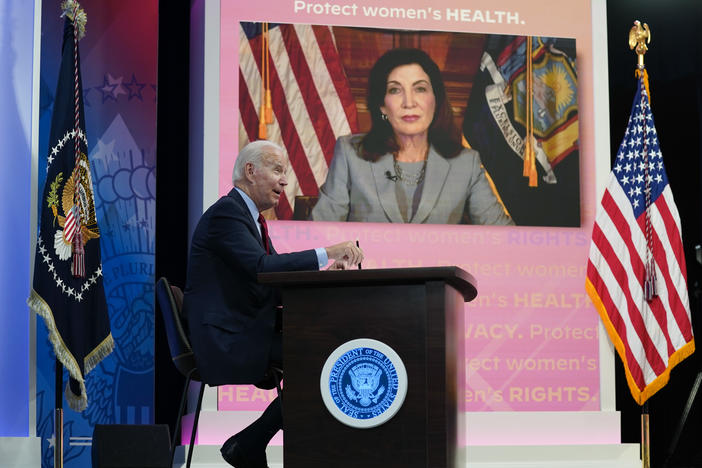President Joe Biden speaks as New York Gov. Kathy Hochul appears on a screen during a virtual meeting with Democratic governors on abortion rights on Friday.
