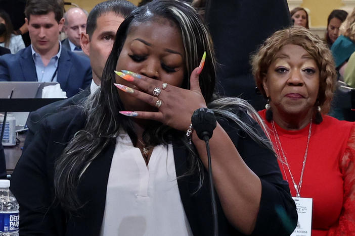 Wandrea "Shaye" Moss, a former Georgia election worker, becomes emotional while testifying about how being singled out in false claims that the 2020 election was stolen from Donald Trump has ruined her life.