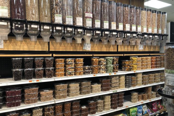 Nuts and dried fruit items at a grocery store.