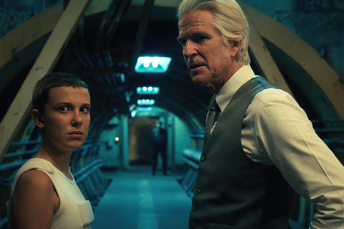 Millie Bobby Brown as Eleven and Matthew Modine as Dr. Martin Brenner in <em>Stranger Things</em>.