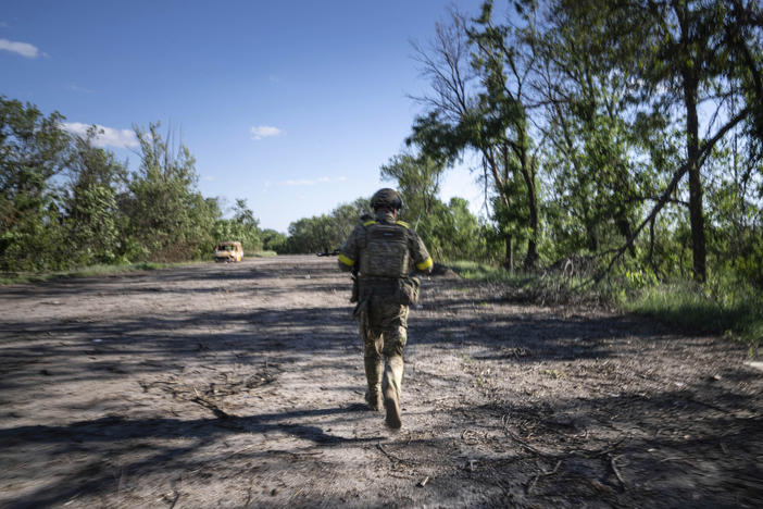 A Ukrainian serviceman changes his position at the frontline near Kharkiv, Ukraine, on Saturday, July 2, 2022.