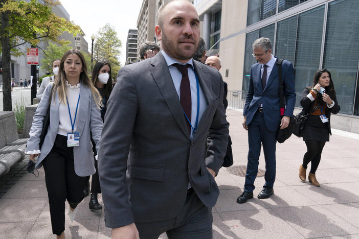 FILE - Argentina's Economy Minister Martin Guzman walks outside of the International Monetary Fund, IMF, building during the IMF Spring Meetings, in Washington, April 21, 2022. Guzman announced his resignation on Saturday, July 2, via twitter.