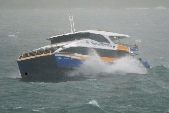 The Manly Ferry makes its way through heavy swells across Sydney Harbour, Australia, Sunday, July 3, 2022.