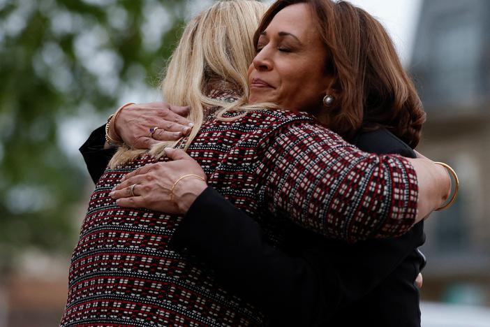 Vice President Kamala Harris hugs Highland Park, Ill., Mayor Nancy Rotering on Tuesday as she visits the site of a shooting Monday that killed seven people.