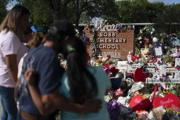 People visit a memorial at Robb Elementary School in Uvalde, Texas, on June 2, 2022, to pay their respects to the victims killed in a school shooting.