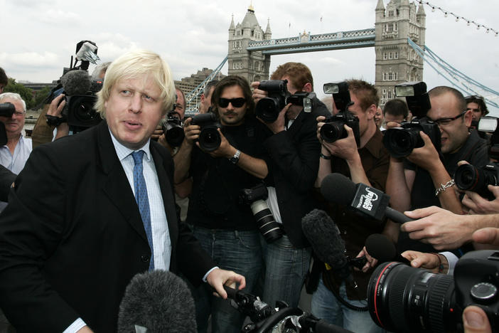 Britain Conservative Party MP, Boris Johnson, left, speaks to the media to launch his campaign as a candidate to be the Mayor of London, outside City Hall in central London, Monday, July 16, 2007.