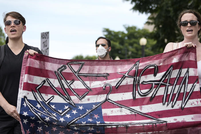 Abortion rights activists march from the Supreme Court to the House of Representatives office buildings on Wednesday.
