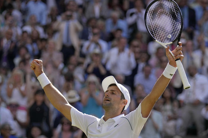 Serbia's Novak Djokovic celebrates winning the Wimbledon men's title on Sunday — his seventh trophy at the British tournament.