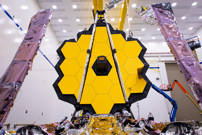 The James Webb Space Telescope (shown here being tested on earth) is expected to reveal some of the most spectacular views of the Universe ever seen.