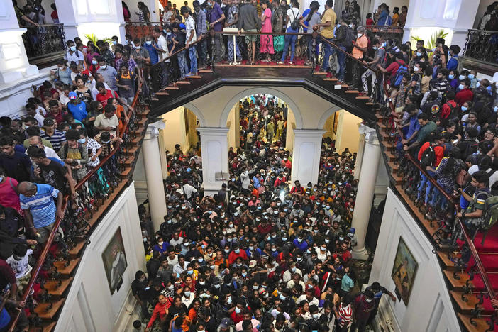People throng President Gotabaya Rajapaksa's official residence for the second day after it was stormed in Colombo, Sri Lanka, on Monday.
