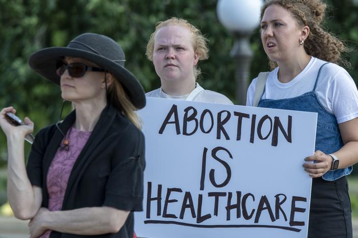 Supporters of abortion rights rally at the Minnesota State Capitol Building in downtown St. Paul following the U.S. Supreme Court ruling to overturn <em>Roe v. Wade</em>.