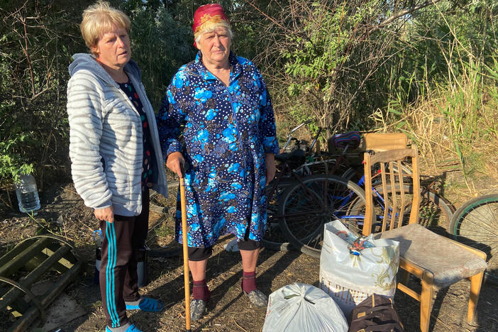 Inna Kravchenko, 52, and her mother, Raïsa Kozlova, 75, moments after crossing by bike from Russian-occupied territory in the Kherson region to the Ukrainian-controlled village of Zelenodolsk. They were able to bring three bags of belongings but fear their house they left behind will be destroyed by Russian soldiers.