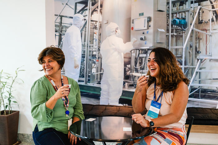 Patricia Neves (left) and Ana Paula Ano Bom take a break at the institute in Rio de Janeiro where they work. The two scientists say they've been inseparable since they met in college. Now their friendship has made it possible to launch a remarkable partnership to make mRNA vaccines accessible to the world.