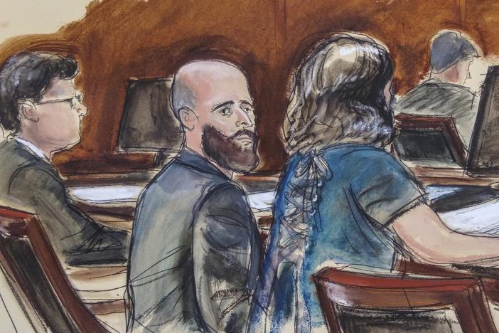 In this courtroom sketch, Joshua Schulte (center) is seated at the defense table flanked by his attorneys on March 4, 2020, in New York.
