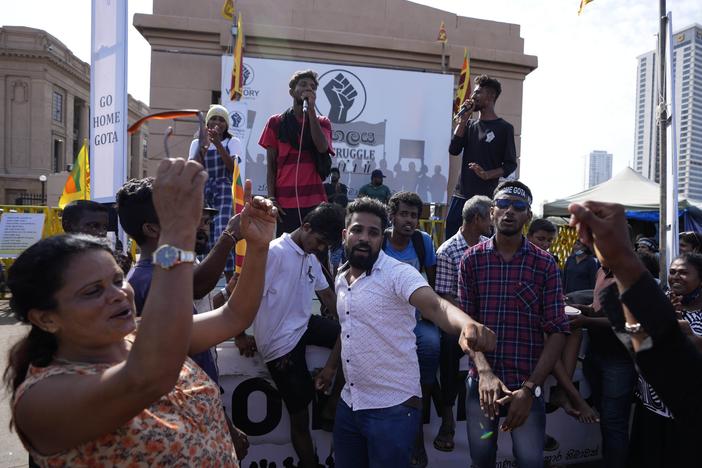 Protesters dance shouting slogans against president Gotabaya Rajapaksa outside his office in Colombo, Sri Lanka on Wednesday. The president of Sri Lanka fled the country early Wednesday, slipping away in the middle of the night only hours before he was to step down amid a devastating economic crisis that has triggered severe shortages of food and fuel.