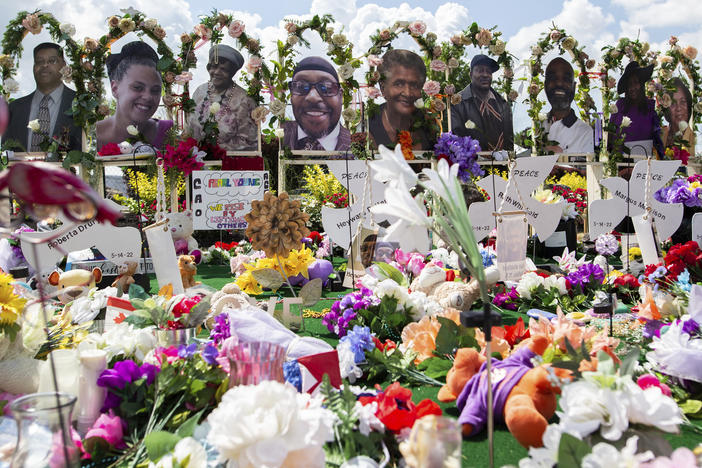 The white gunman who killed 10 Black people and injured three other individuals at a Tops supermarket in Buffalo, N.Y., in May was indicted by a federal grand jury on Thursday on hate crimes and firearm charges. Here, a memorial for the supermarket shooting victims is set up outside Tops on July 14.