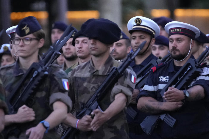 French soldiers march on the Champs Elysees avenue during a rehearsal for the Bastille Day parade in Paris, France, Monday, July 11, 2022.