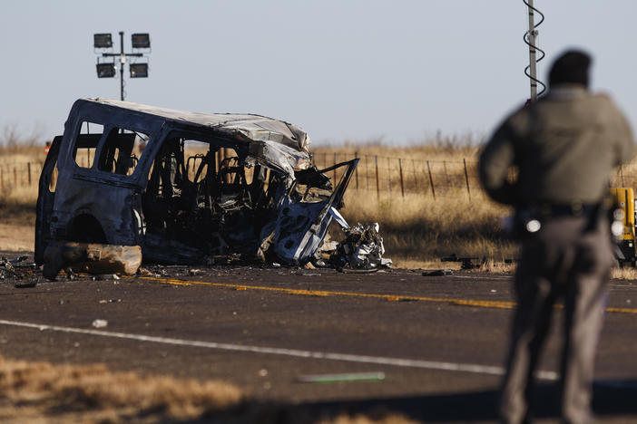 Texas Department of Public Safety Troopers look over the scene of a fatal collision in March in Andrews County, Texas. A pickup truck crossed the center line of a two-lane road and crashed into a van carrying members of the University of the Southwest men's and women's golf teams.