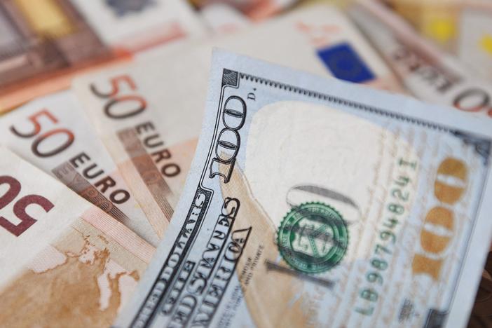 The dollar and the euro are flirting with "parity" for the first time in two decades.