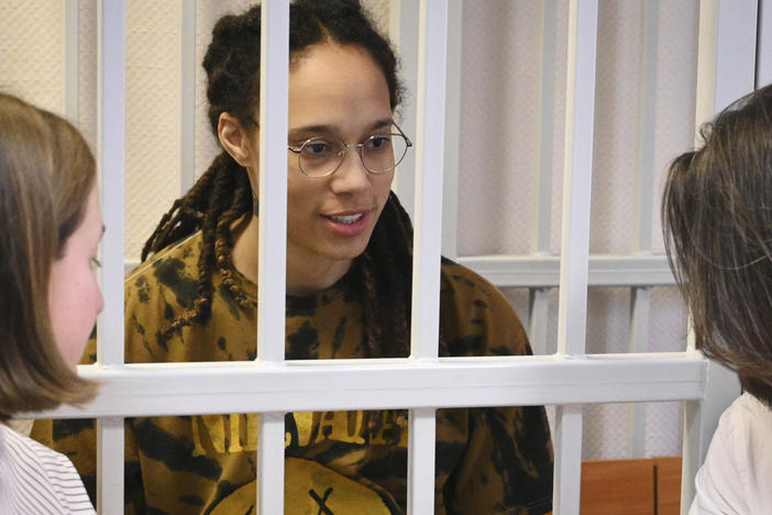 WNBA star Brittney Griner speaks with her lawyers in the courtroom near Moscow on Friday.