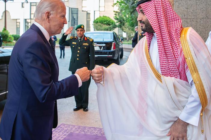 In this photo released by the Saudi Press Agency, Saudi Crown Prince Mohammed bin Salman and President Biden bump fists as they begin meetings in Jeddah.