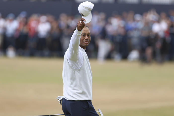 Tiger Woods gestures to the crowd at the end of his second round of the British Open at St. Andrews, Scotland, on Friday.