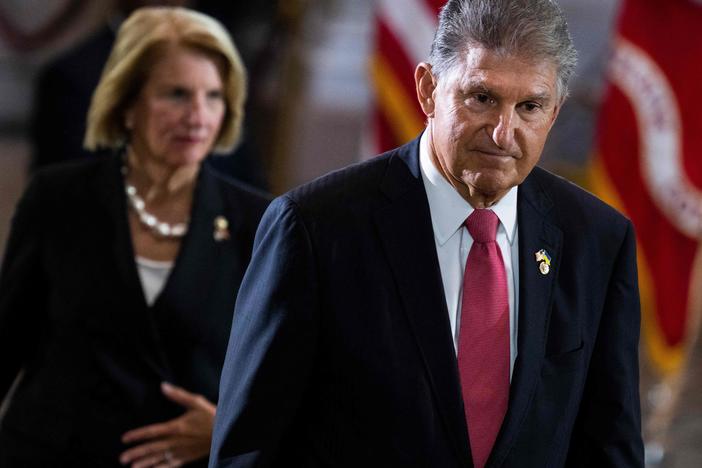 US Sen. Joe Manchin (D-WV)  pays respects to US Marine Corp Chief Warrant Officer 4, Hershel Woodrow Woody Williams, laying in honor at the Rotunda of the US Capitol in Washington, DC, on July 14, 2022.