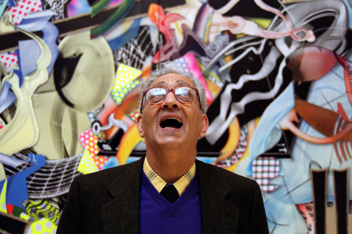 Frank Stella with one of his works at the Royal Academy's Summer Exhibition in London in 2000.