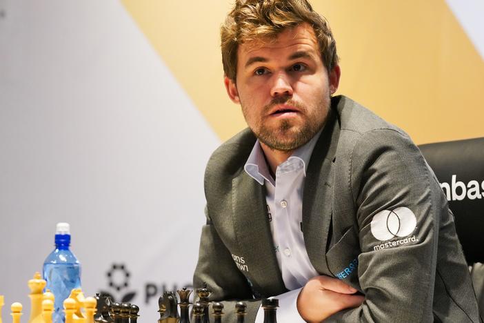 Magnus Carlsen of Norway competes during the FIDE World Championship in in Dubai, United Arab Emirates, on Dec. 10, 2021.