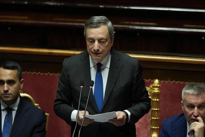 Italian Premier Mario Draghi (center) flanked by Foreign Minister Luigi Di Maio (left) and Defense Minister Lorenzo Guerini, delivers his speech at the Senate in Rome on Wednesday.