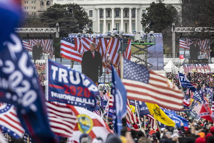 Supporters cheer as President Donald Trump addresses them during a rally on Jan. 6, 2021. A NPR/<em>PBS NewsHour</em>/Marist poll found that a majority of respondents blame Trump for the attack on the Capitol that followed the rally, but that a slightly larger majority don't think he'll face charges.