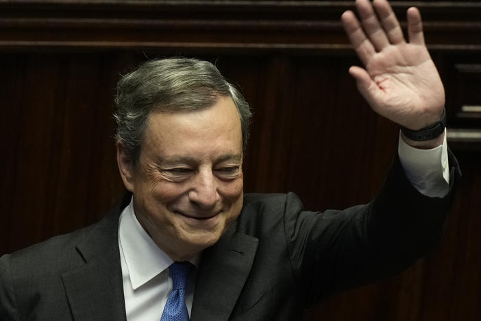 Italian Premier Mario Draghi waves to lawmakers at the end of his address at the Parliament in Rome on Thursday.