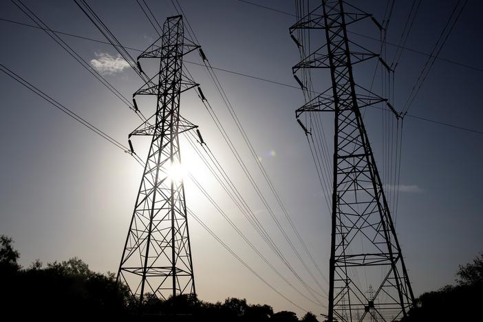 Power transmission lines span toward San Antonio, Texas. More than 100 million people are currently under heat-related warnings and advisories across the United States, the National Weather Service Weather Prediction Center said Tuesday.