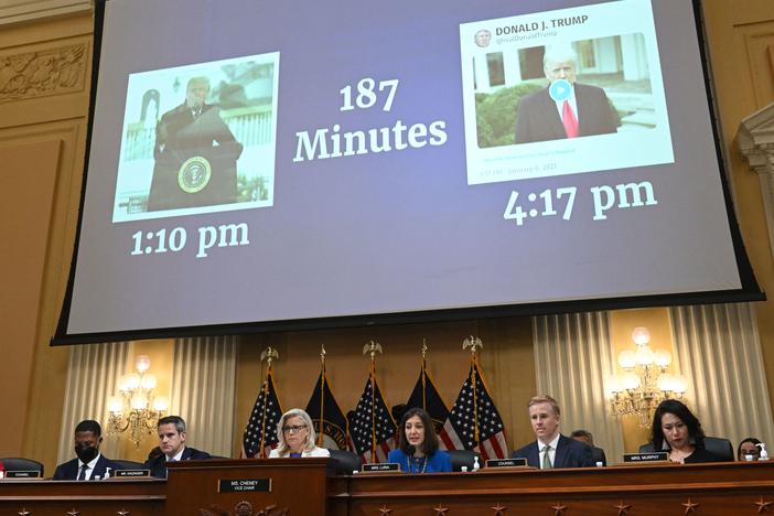 "187 Minutes" is displayed on a screen between images of former President Trump during a hearing by the House Select Committee on July 21, 2022.