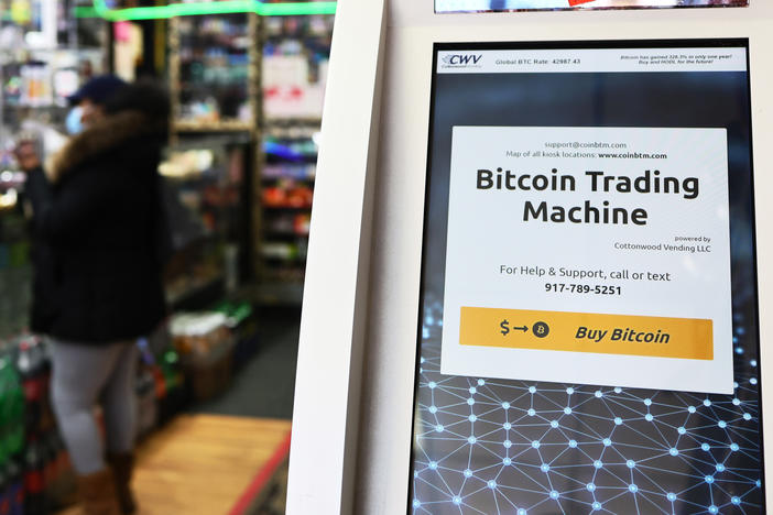 Tesla has pulled back from its $1.5 billion investment in Bitcoin, which it announced in early 2021. Here, a Bitcoin ATM is seen last year inside a New York City store.