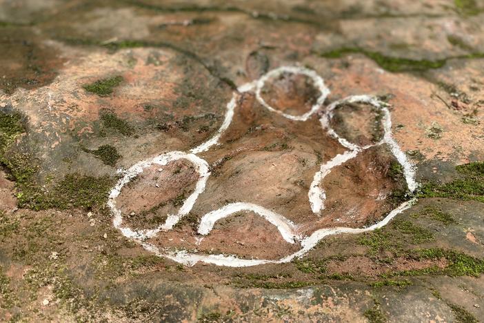 One outline of a footprint discovered in the restaurant courtyard.