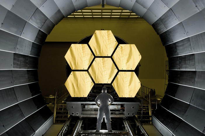 NASA engineer Ernie Wright looks on as the first flight-ready mirrors for the James Webb Space Telescope are prepared to undergo testing.