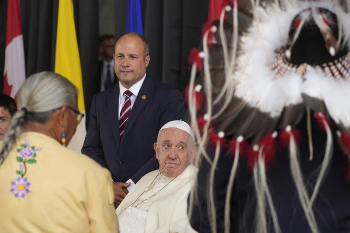 Pope Francis meets the Canadian Indigenous people as he arrives at Edmonton's International airport, Canada, on Sunday.