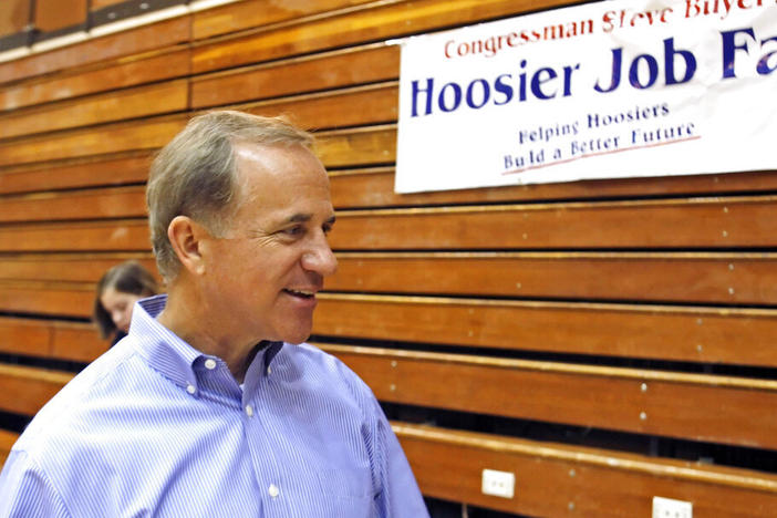 Then-Rep. Stephen Buyer, R-Ind., talks in 2010 during a job fair in Lafayette, Ind. The former U.S. congressman is among nine people charged Monday in four separate and unrelated insider trading schemes.