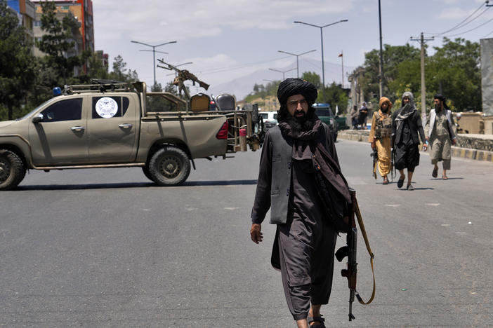 Taliban fighters guard the site of an explosion in Kabul, Afghanistan. Last month, several explosions and gunfire ripped through a Sikh temple in Afghanistan's capital.