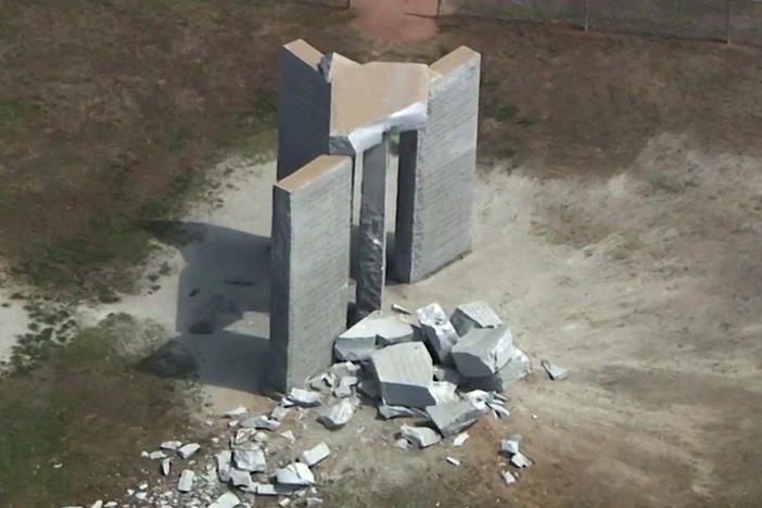 Rubble is cast around the Georgia Guidestones after an explosion in Elberton, Georgia, U.S., July 6, 2022 in a still image from video.